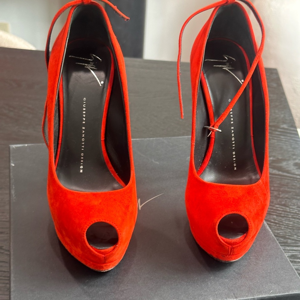 Beautiful red suede high heals with a platform gently worn.